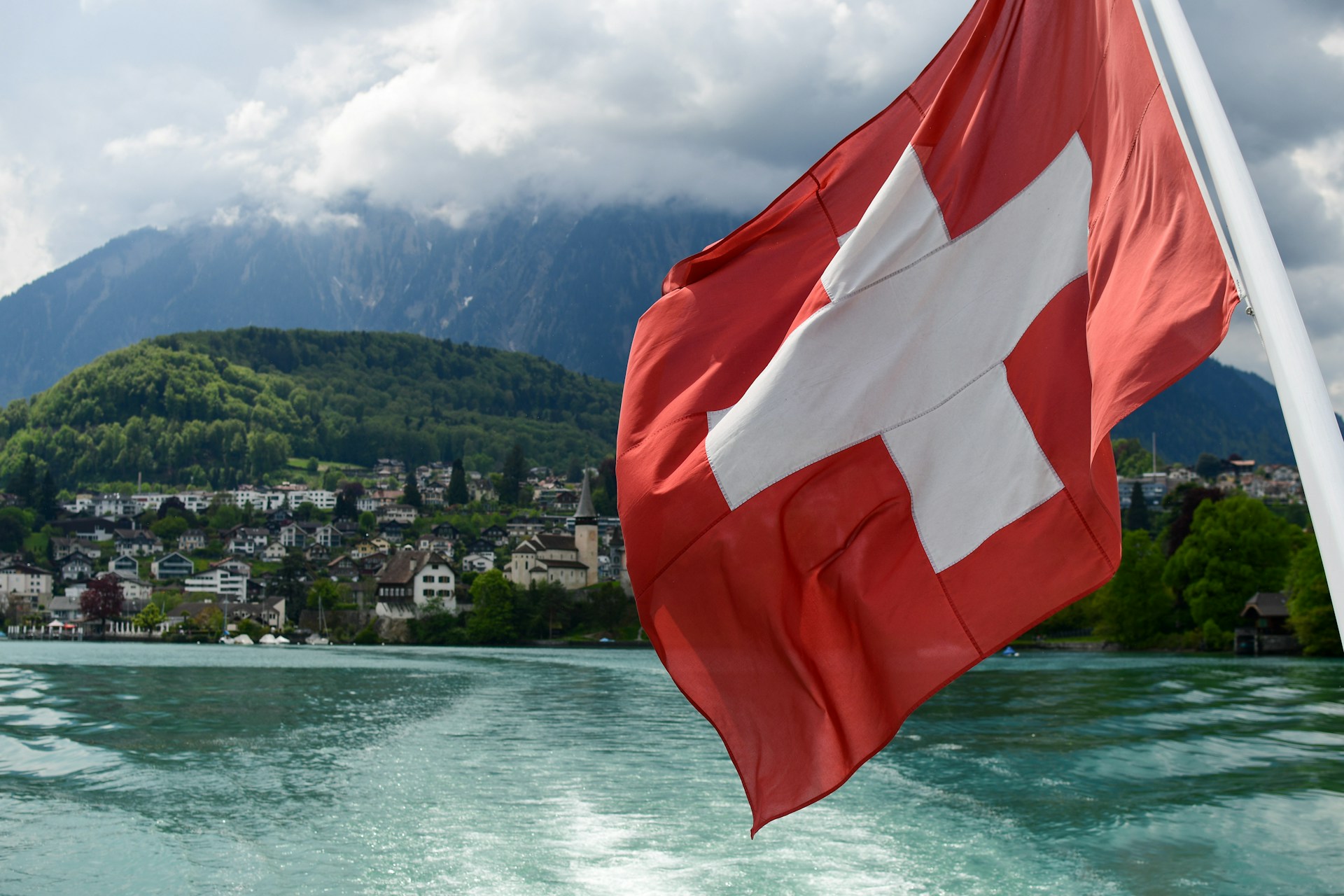 The Swiss flag overlooking a harbour.