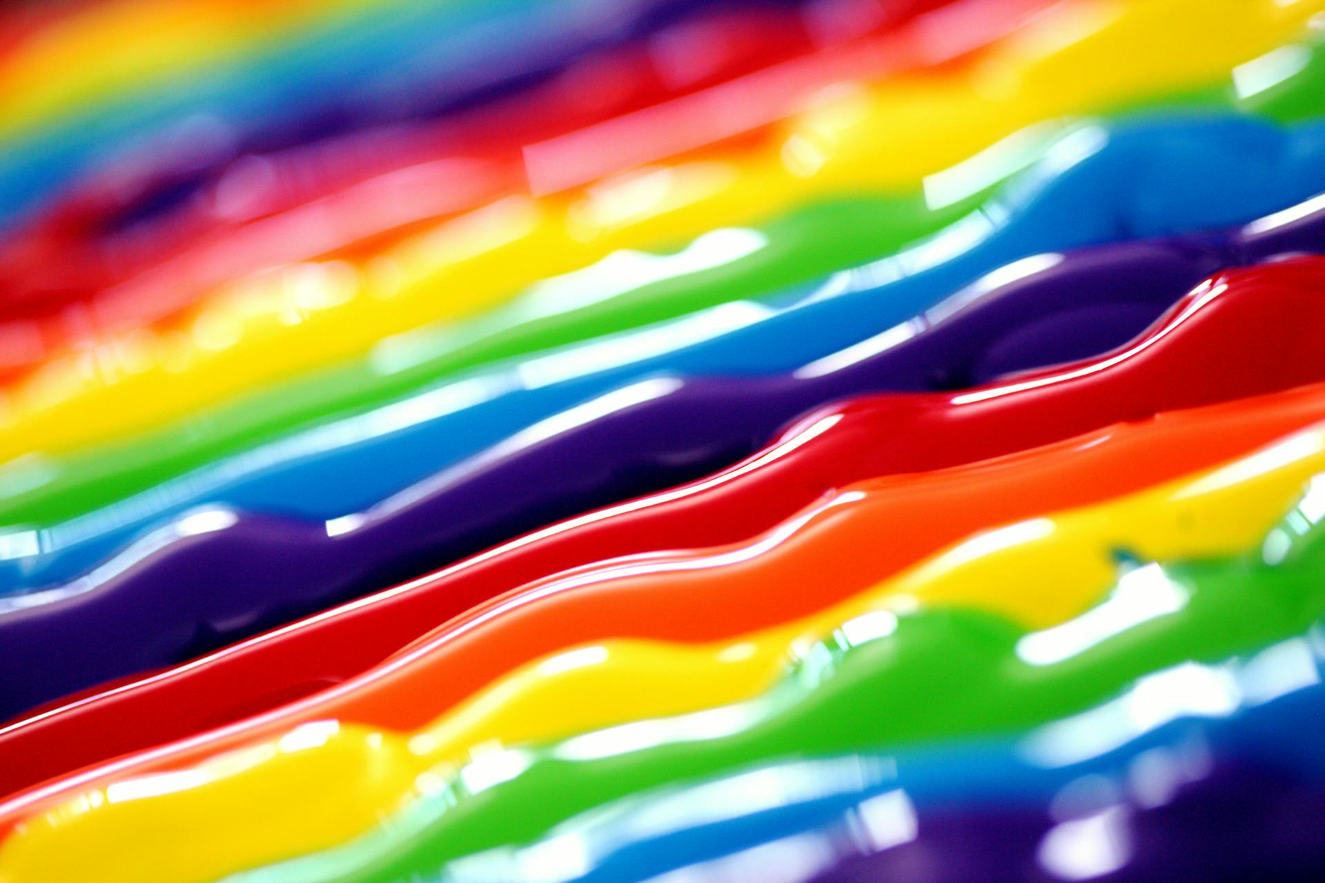 Lines of rainbow-coloured paint strips.