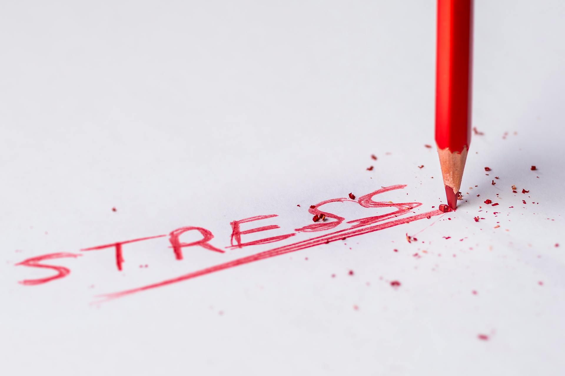 The word 'Stress' written in red pencil.