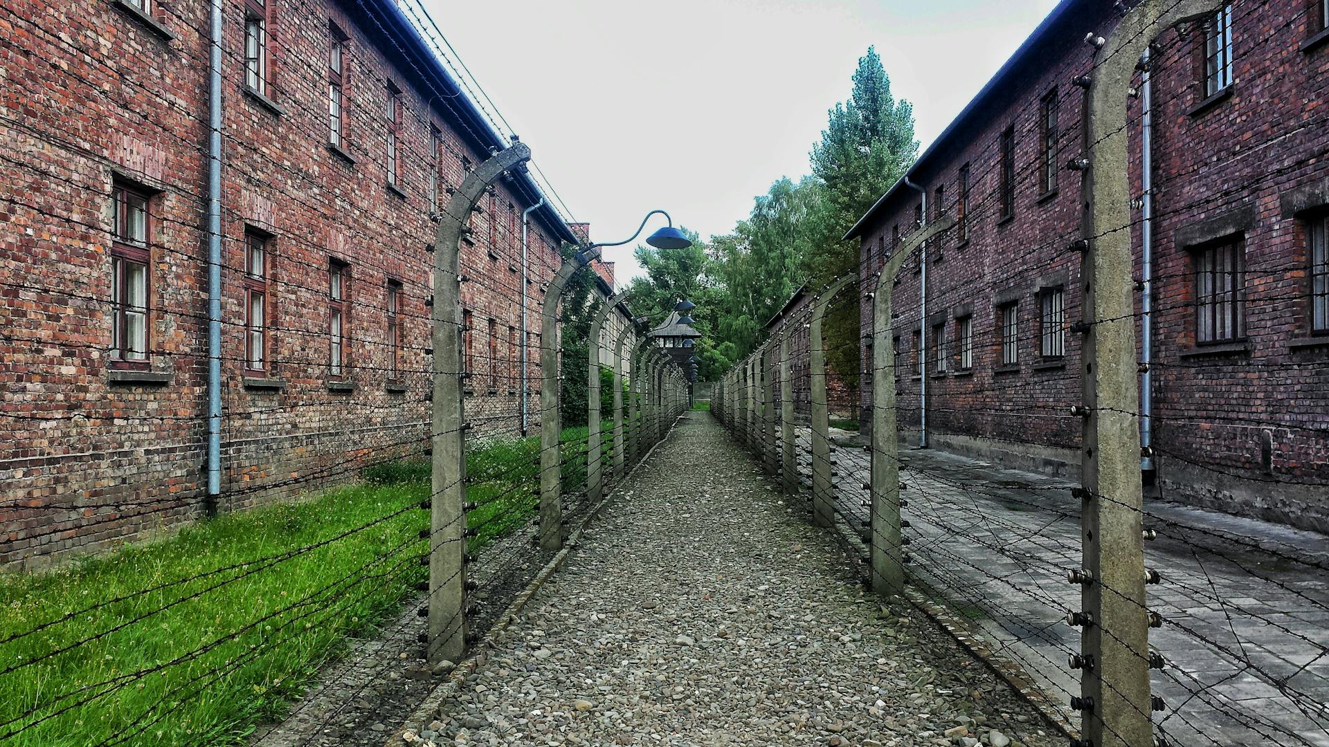 Two prison buildings with cells, overlooking a prison yard.