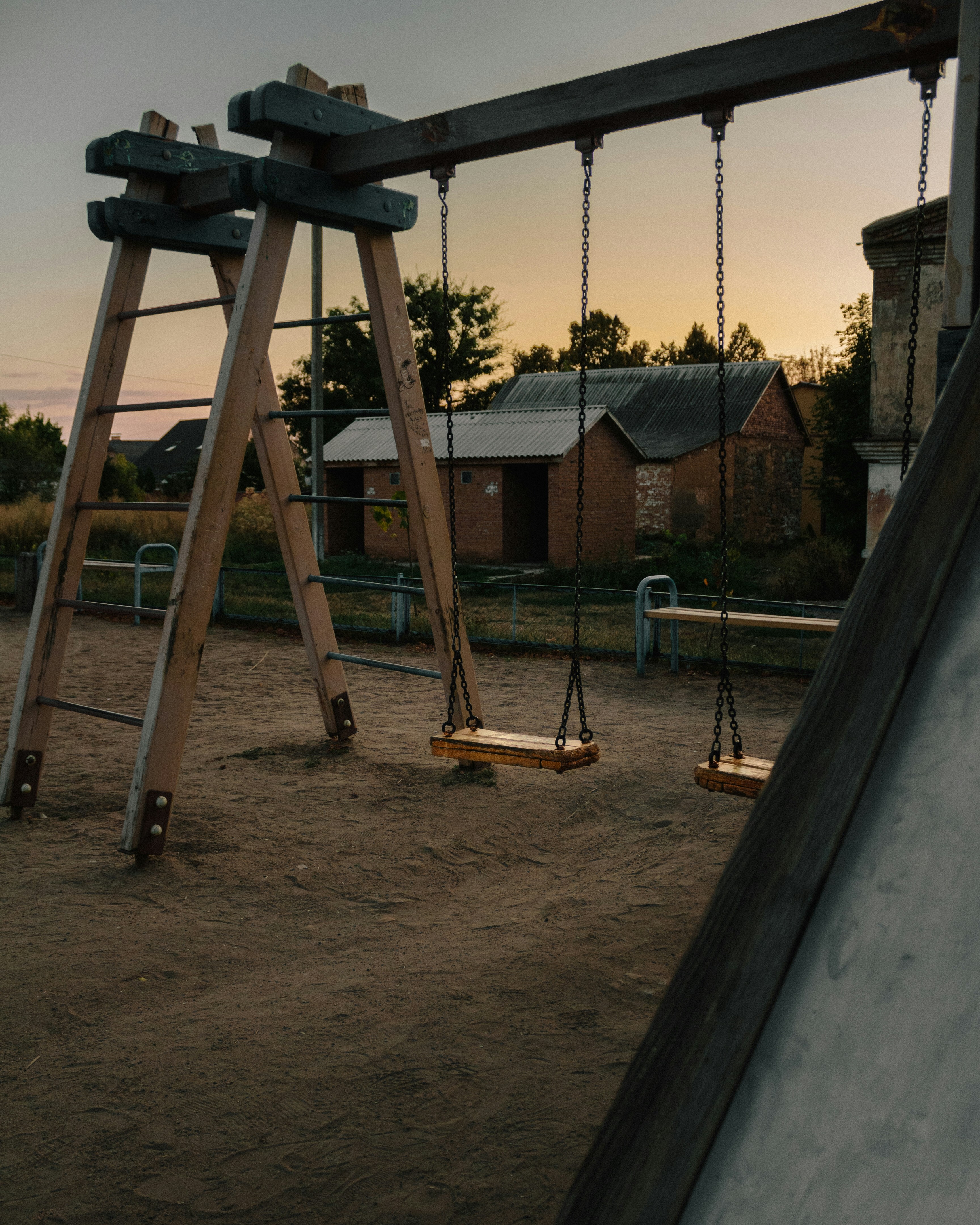 Two swings in the sunset.