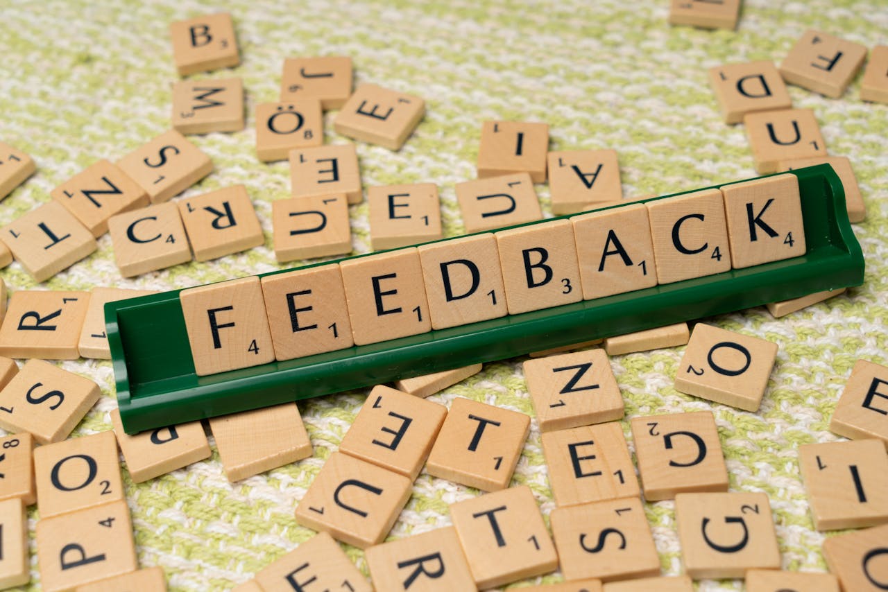 The word 'Feedback' spelt out in Scrabble letters.